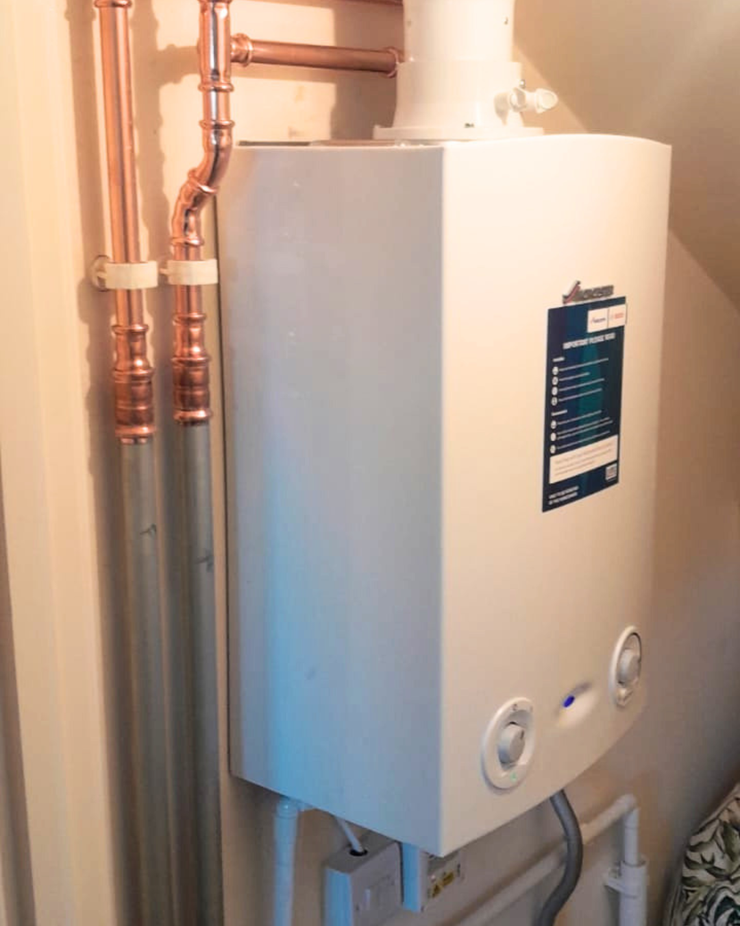 Worcester Bosch boiler installed and showing pipes